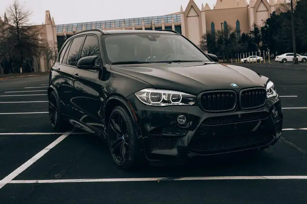 Black SUV with fresh gloss after detailing